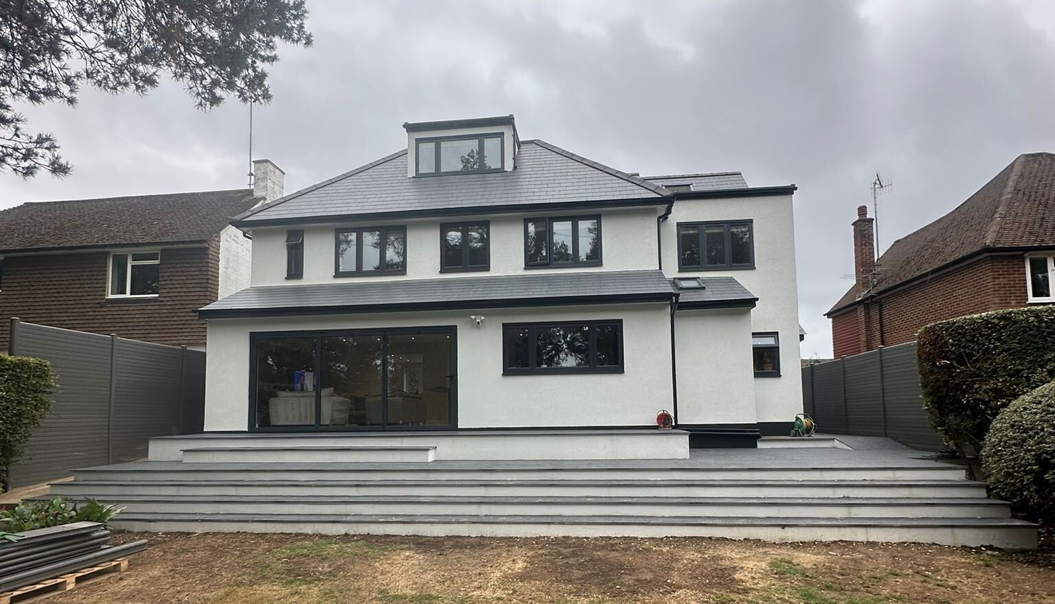 Two-storey rear extension with a glazed elevation to a detached family home