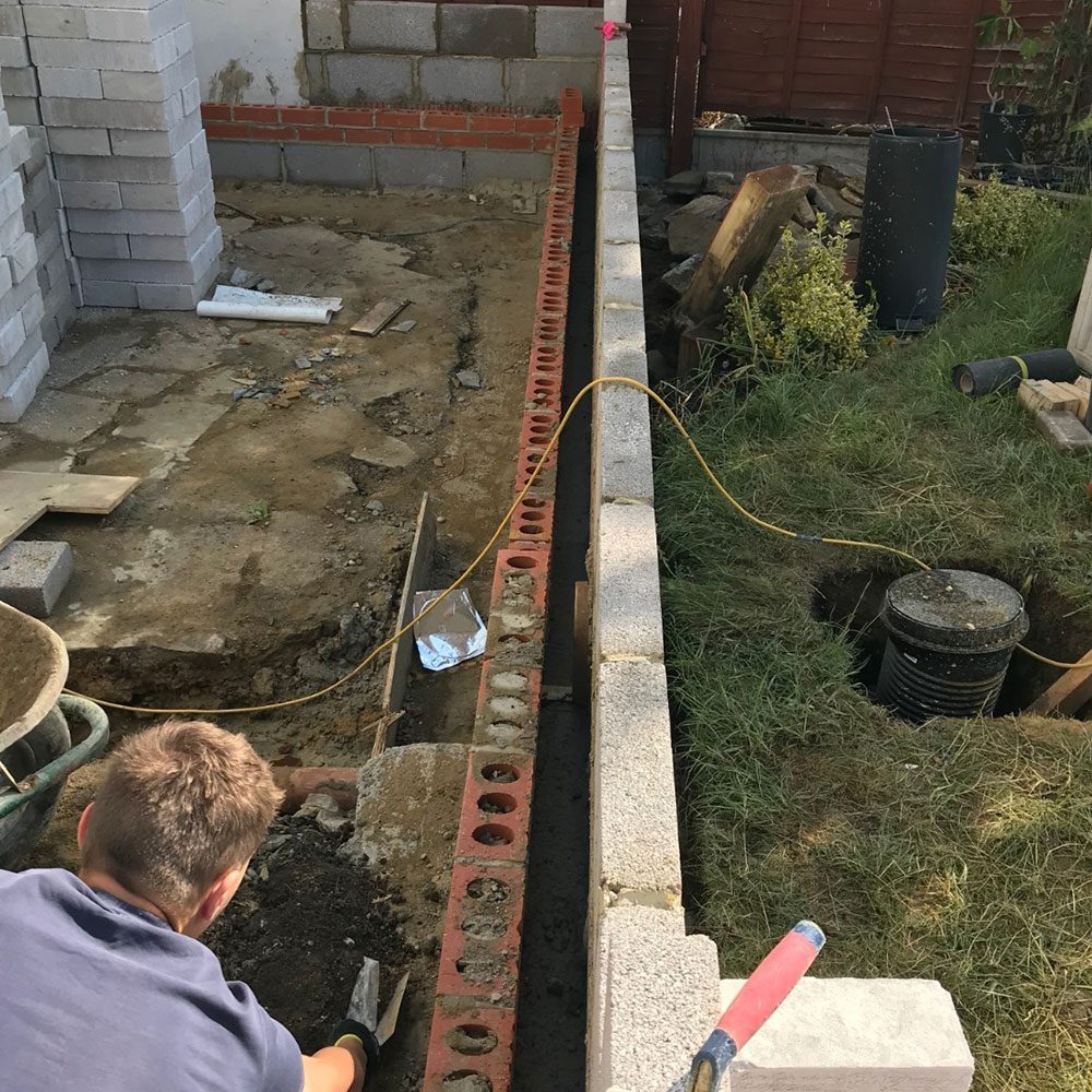Groundworks and drainage being installed for an extension