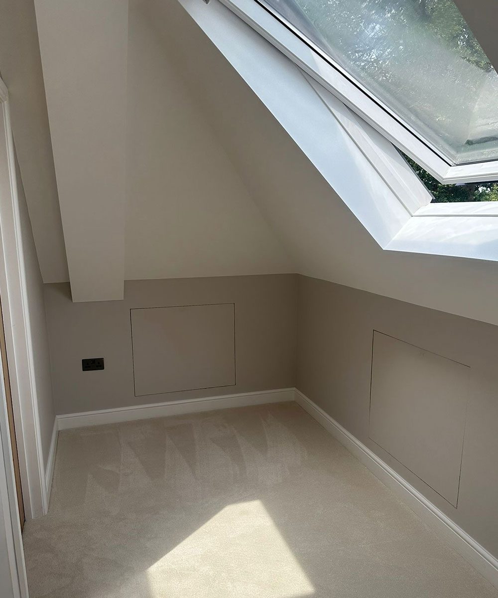 Loft room with a Velux window and built-in eaves storage