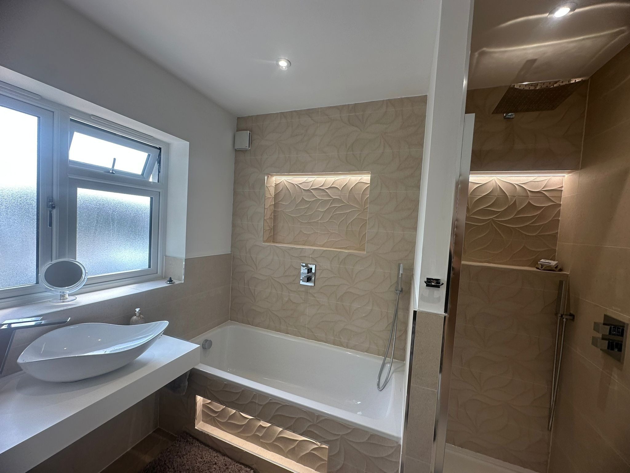 Refurbished luxury bathroom with a freestanding bath and walk-in shower