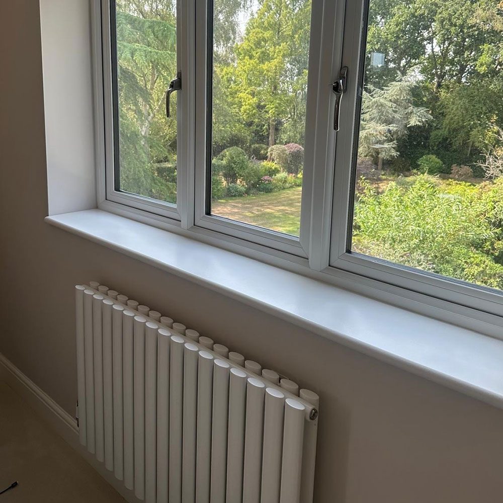 Refurbished room with a new window and radiator
