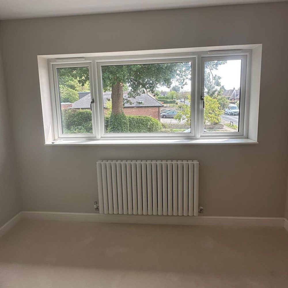 Refurbished room with a new window and radiator
