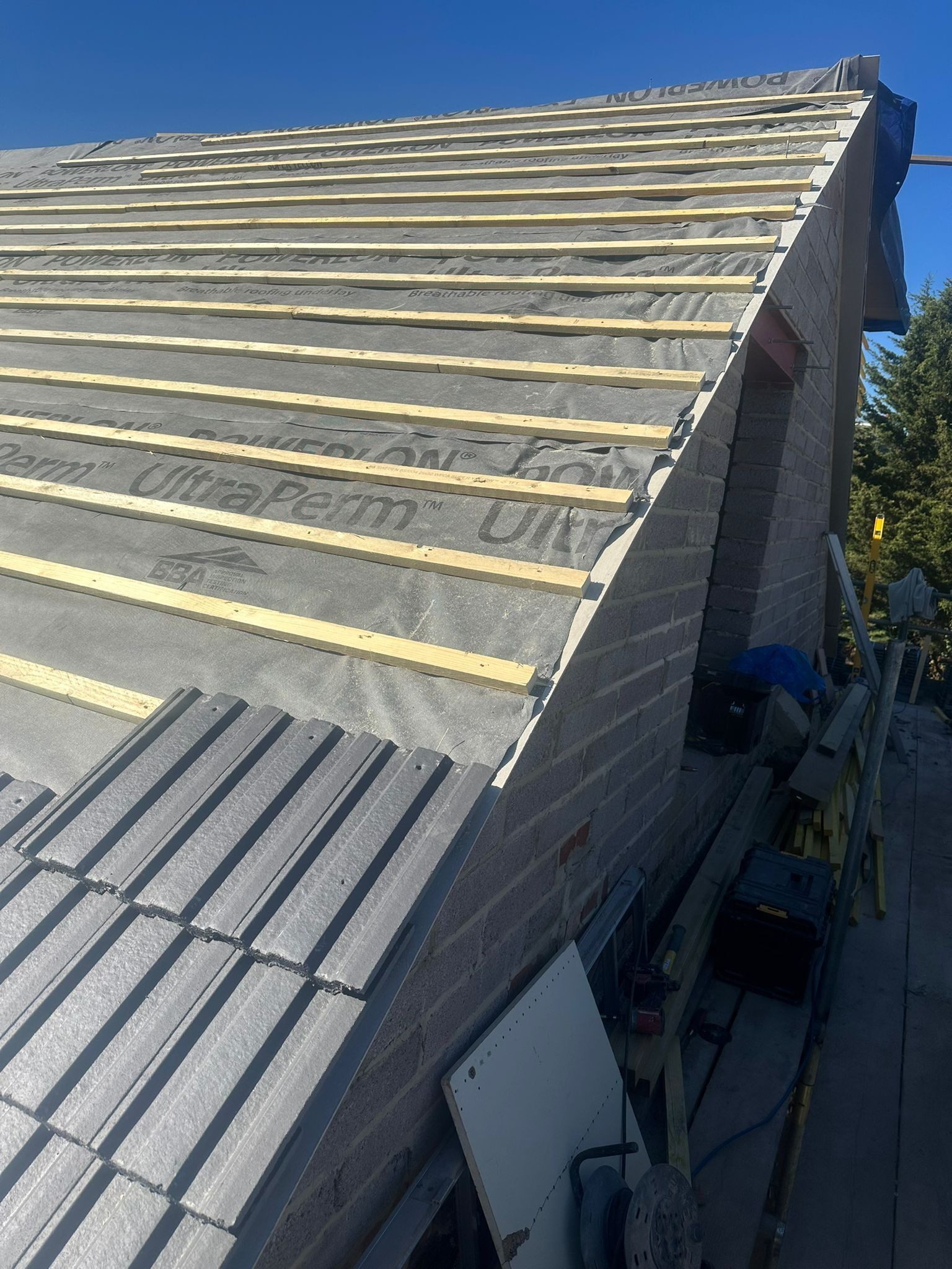 Roof valley and tiling viewed from above during installation