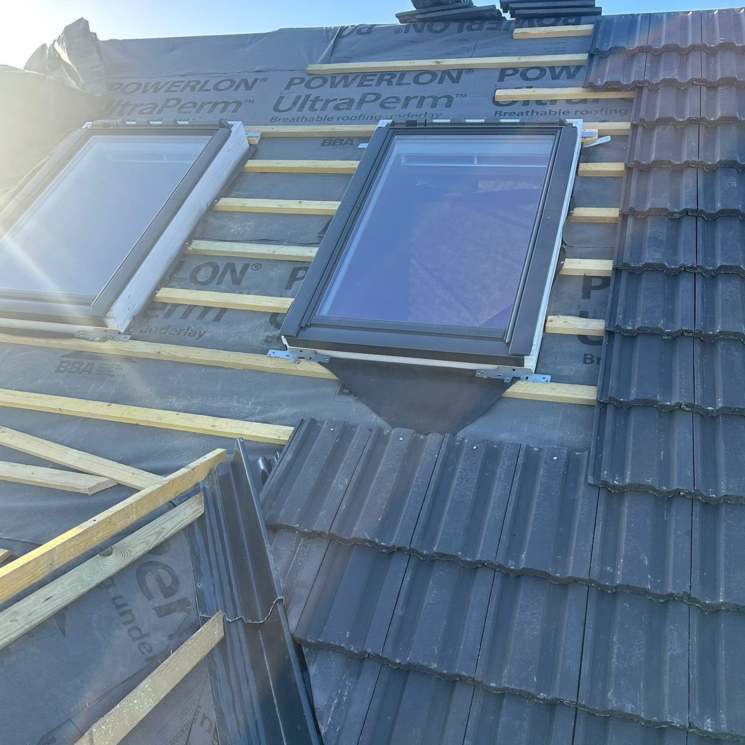 Roof windows installed in a tiled roof
