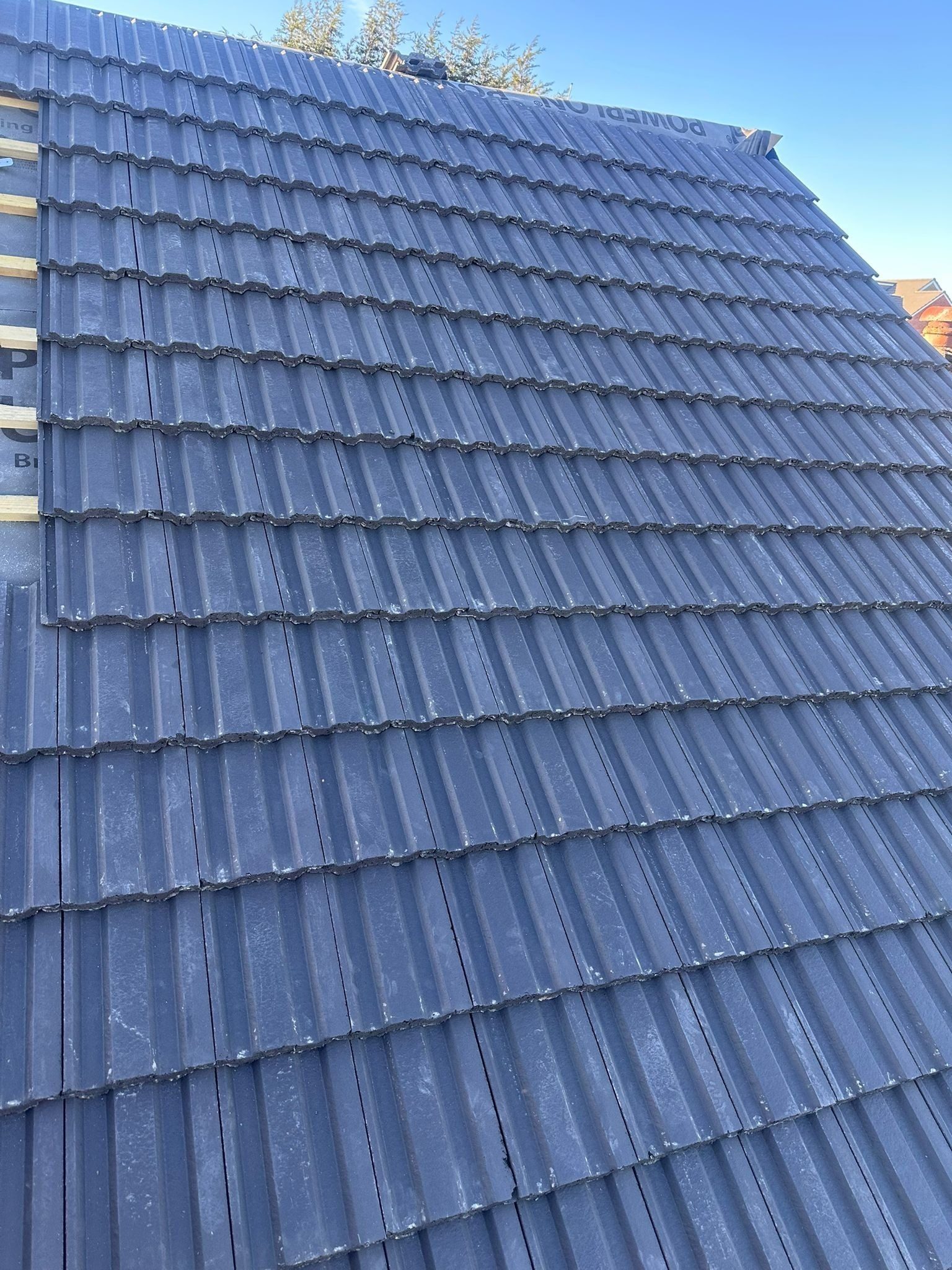 Slate effect roof tiling newly laid
