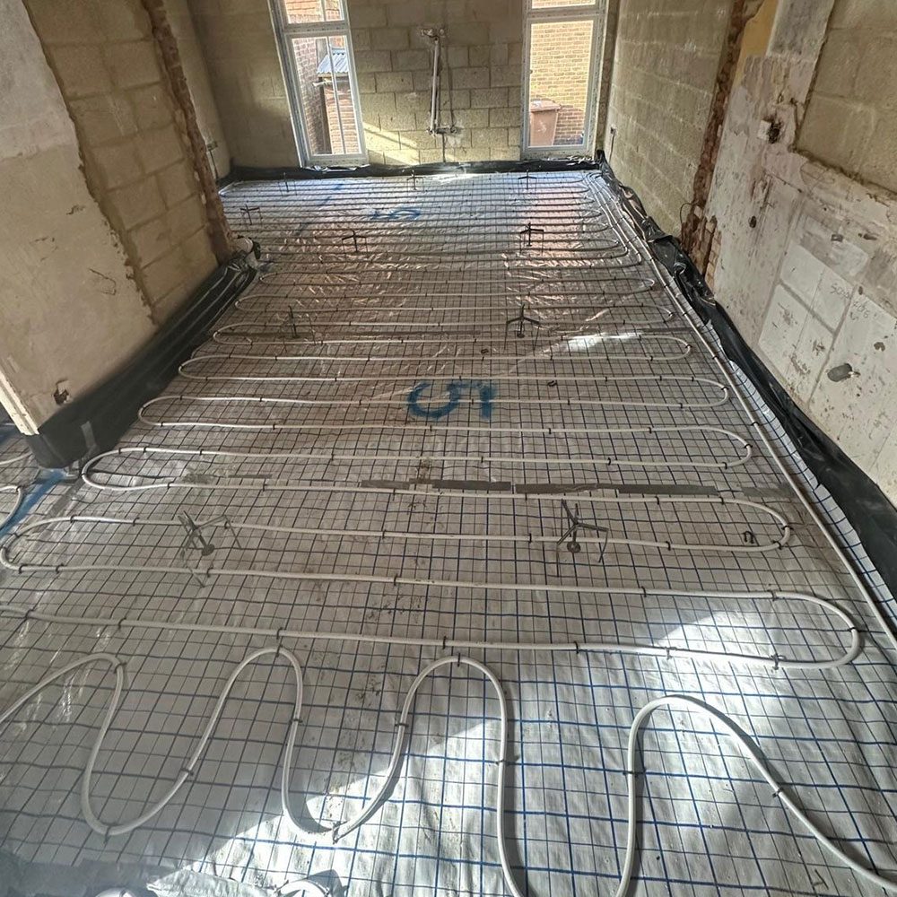 Underfloor heating pipework laid on insulation board before screeding