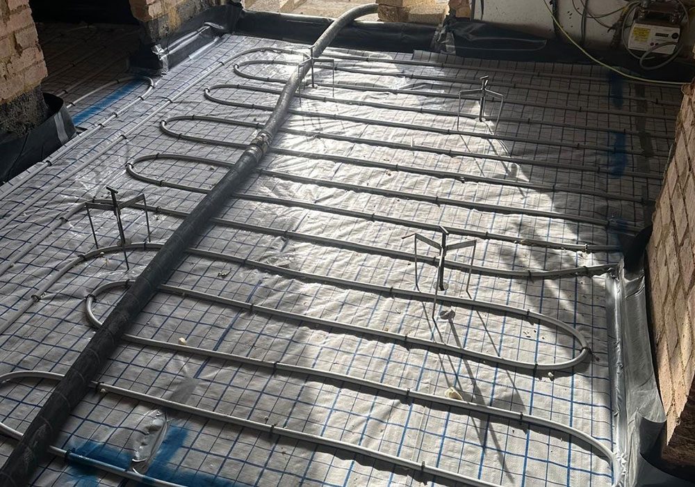 Underfloor heating mat laid before screeding
