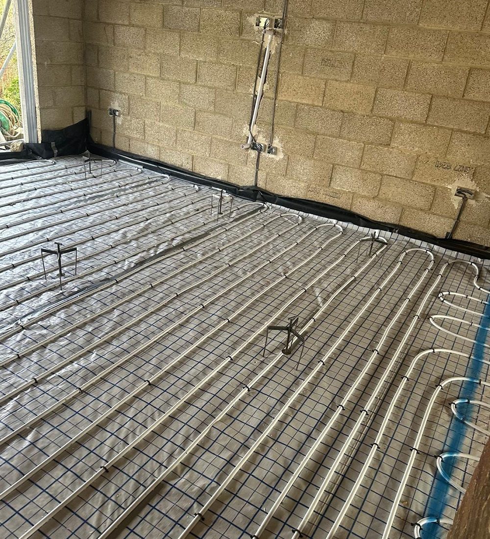 Underfloor heating pipework embedded in screed